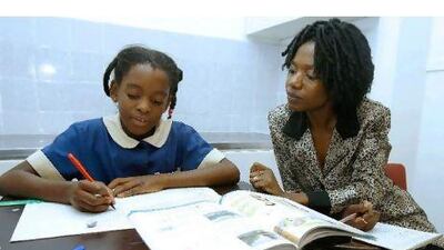 Zimbabwe's investment in education for its citizens is paying off, not in terms of better local skills, but in higher remittances from abroad. Desmond Kwande / AFP