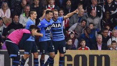 Harry Kane and Dele Alli celebrate with Erik Lamela on Saturday during Tottenham’s Premier League victory. Tony O’Brien / Action Images / Reuters