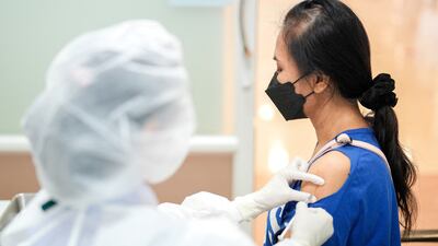 A dose of the Pfizer-BioNTech vaccine is administered. Authorities have played down the potential risk of stroke linked to the shot. Photo: Reuters