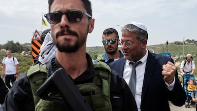 Israeli Security Minister Itamar Ben-Gvir joins Israeli settlers as they hold a protest march to the Israeli settler outpost of Evyatar, in the Israeli-occupied West Bank. Reuters
