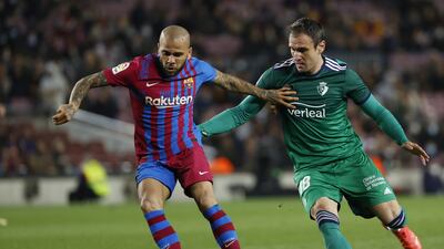 Barcelona full-back Dani Alves on the ball against Osasuna's Kike Garcia. EPA