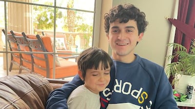 Saleh Busaibe, 19, an Emirati pupil at Brighton College Abu Dhabi, received A* grades in maths and economics, and an A in further mathematics. He is pictured with his younger brother, Salman.