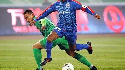 In China's football leagues, a willingness to pay for foreign players is even more apparent, even though the clubs generate modest revenues, a reported $3m a year in the case of the Chinese Super League's Shanghai Shenhua. Above, French International player Nicolas Anelka from Shanghai Shenhua. AFP
