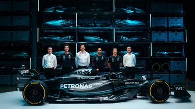 Mercedes' George Russell, team principal Toto Wolff, Lewis Hamilton and reserve driver Mick Schumacher with the new W14 E car for the 2023 season in Silverstone. AFP