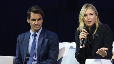 Roger Federer, left, and Maria Sharapova talk onstage during the Summer Nights player party at Brisbane City Hall ahead of the 2016 Brisbane International on January 2, 2016 in Brisbane, Australia. (Photo by Chris Hyde/Getty Images)