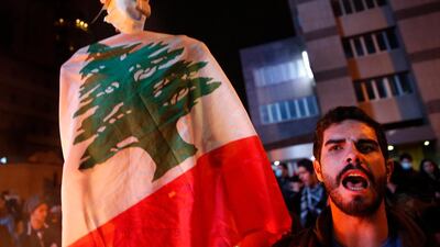 A protester shouts slogans during ongoing protests against the country's financial woes in Beirut. AP Photo