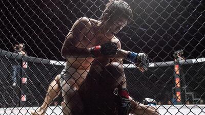 The One Fighting Championship "Reign Of Champions" mixed martial arts tournament held at the Dubai World Trade Center. Kamal Shalorus (Iran, shaved head) is beaten by reigning champion Shinya Aoki (Japan, dark hair) in the first round of the Lightweight World Championship match. Antonie Robertson / The National