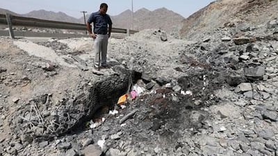 Zubair Saeed at the site where his brother, 29-year-old Umair, was killed in an crash on Sharjah-Kalba road. Pawan Singh / The National