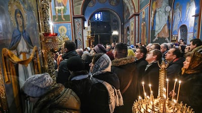 People attend the first liturgy since the creation of a new Ukrainian church independent from Russia in the Saint Michael’s Golden-Domed Cathedral in Kiev. AFP