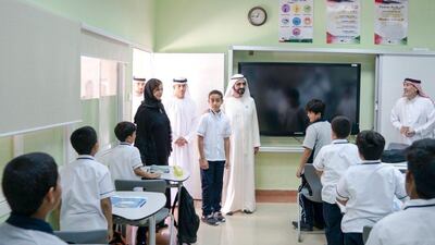 Sheikh Mohammed bin Rashid, Vice President and Ruler of Dubai, visits Khalifa Al Kaabi at Al Qudwa School to thank him for saving his schoolmates after their bus caught fire. Courtesy Dubai Media Office