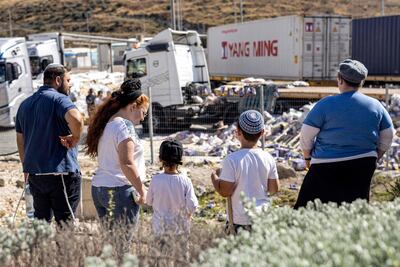 Damaged lorries that had been carrying humanitarian aid, on the Israeli side of the Tarqumiyah crossing with the occupied West Bank. AFP