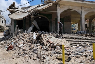 A man inspects the damage at a mosque that was targeted in an Israeli strike in the southern Lebanese village of Kfar Sir. AFP