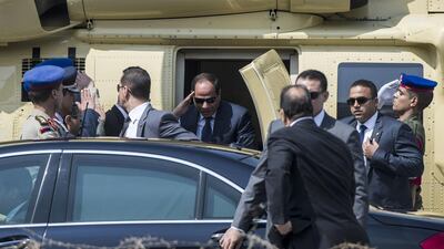 Mr El Sisi salutes official guards as he descends from a helicopter outside the high constitutional court in the capital of Cairo before his swearing-in ceremony. Khaled Desouki/AFP Photo