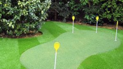 Consider the shape, size and layout of your garden before deciding on the kind of putting green you want. Choose the right plants to frame the area, making sure there is enough clearance to allow for the entire green to be used.