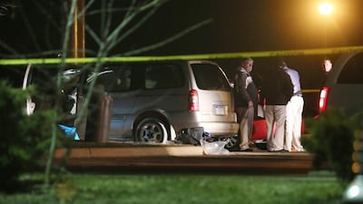 Police investigate the scene early on February 21, 2016, where people were shot in vehicles outside a Cracker Barrel restaurant in Kalamazoo, Michigan. A suspect has been arrested. Mark Bugnaski/Kalamazoo Gazette