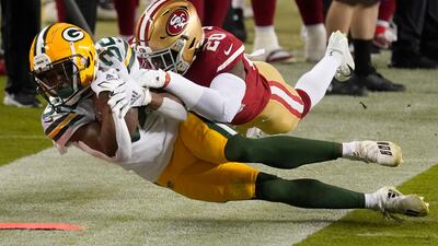 Green Bay Packers running back Tyler Ervin (32) is tackled by San Francisco 49ers free safety Jimmie Ward (20) during the first half of an NFL football game in Santa Clara, California. AP Photo