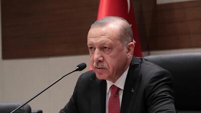 Turkey's President Recep Tayyip Erdogan speaks to the media before his departure for Argentina to attend G-20 meetings, at Ataturk airport in Istanbul. AP