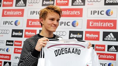 Martin Odegaard holds his new Real Madrid shirt in January, 2015. Getty