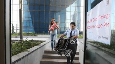 Mossine Koulakzian and his wife Yeva Avagyan have to carry their child and the pushchair when they want to use the leisure facilities at The Arc At Gate Towers because of access difficulty. Delores Johnson / The National