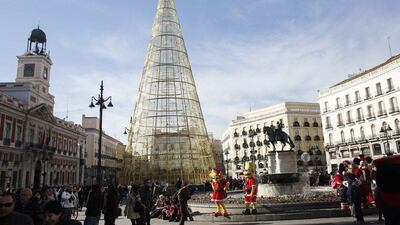 Spain: People shop in Madrid's Puerta del Sol square. Reuters/ Juan Medina