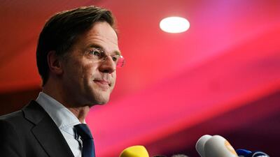 Dutch Prime Minister Mark Rutte reacts to the exit pools of the House of Representatives elections in The Hague. AFP