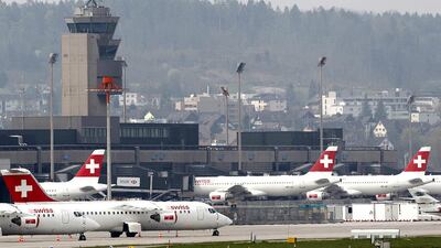 Swiss International Airlines planes sit on the tarmac at Zurich airport. Christian Hartmann / Reuters