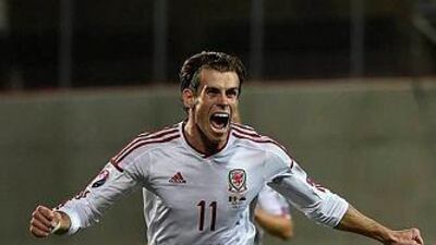 Wales forward Gareth Bale celebrates after scoring a goal during the Euro 2016 qualifying round football match Andorra vs Wales on September 9, 2014 at the Municipal Stadium in Andorra. AFP PHOTO / PASCAL PAVANI