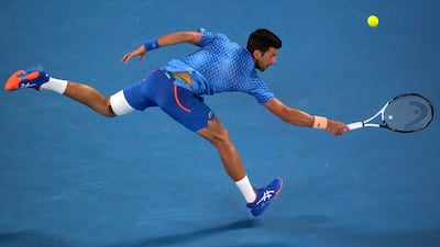 Novak Djokovic stretches for a backhand return. AP