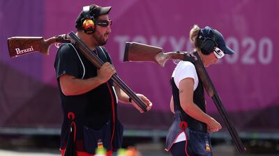 Alberto Fernandez (L) and Fatima Galvez (R) of Spain win the trap mixed team.