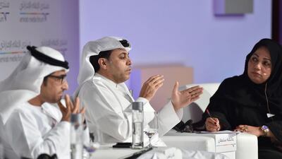Mohammed Al Hammadi, editor-in-chief of Al Ittihad, left, listens as Dhaen Shaheen, director general for publishing, Dubai Media Inc, and editor-in-chief of Al Bayan, centre, makes a point. Moderator Aisha Sultan looks on.