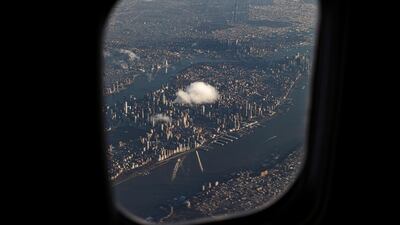 A single cloud is pictured floating over Manhattan in New York, US. Reuters