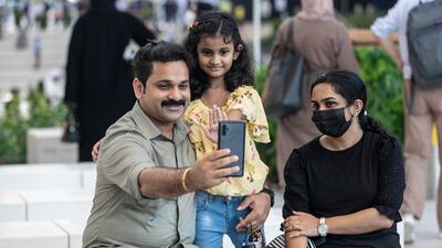 All smiles: a family enjoys a day out at the world's fair.