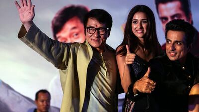 epa05744671 Chinese actor/director Jackie Chan (L), Bollywood actors Disha Patani (C) and Sonu Sood (R) pose for pictures during a promotional event for the upcoming movie 'Kung Fu Yoga', in Mumbai, India, 23 January 2017. The action-adventure comedy movie 'Kung Fu Yoga' will be released in India on 03 February. EPA/DIVYAKANT SOLANKI