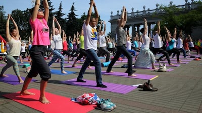 Yoga enthusiasts practice yoga on International Yoga Day in the central Gorky park in Minsk, Belarus. Tatyana Zenkovich / EPA