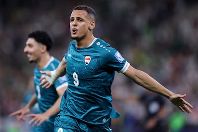 Iraq forward Ali Al Hamadi celebrates scoring during a World Cup qualifying play-off. AFP