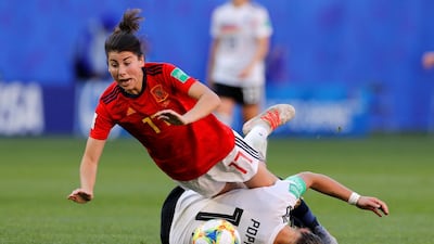 Spain's Lucia Garcia in action with Germany's Alexandra Popp. Reuters