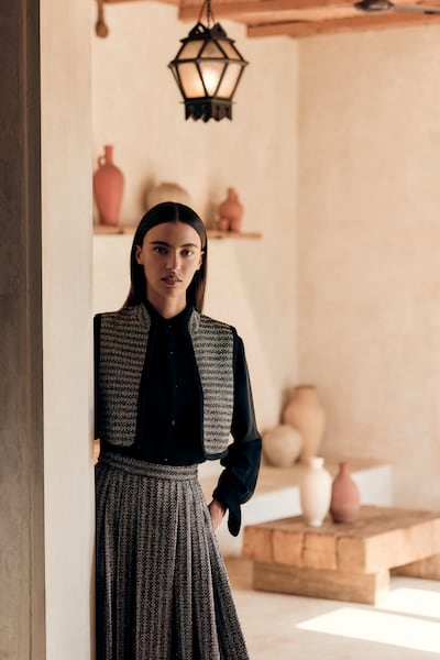 The Vest waistcoat and Aisha skirt are crafted from dark and light Paillettes tweed. Photo: Loro Piana