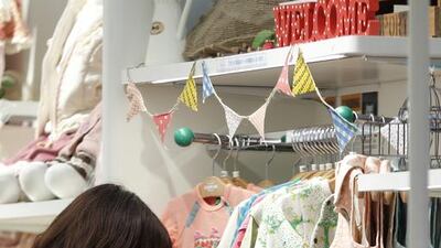 A customer browses baby clothes at a store in the Ginza district of Tokyo. Kiyoshi Ota / Bloomberg News