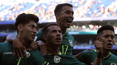 Bolivia's Miguel Terceros, left, celebrates with teammates Robson Matheus, second left, Roberto Fernandez and Ramiro Vaca after scoring a penalty during the World Cup qualifiers semi-final against Suriname in Mexico. AFP