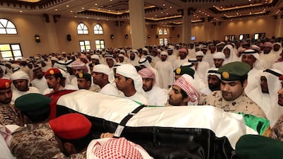 The body of Hamoud Ali Saleh Al Ameri is carried to commence the funeral service at Martyrs Mosque in Al Ain. Jeffrey E Biteng / The National