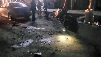 Investigators and passers-by inspect the damage after two bombs ripped though Bamyan city in Afghanistan. Courtesy Mohammad Reza Yousefi.