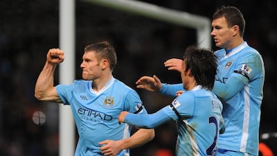 English footballer James Milner, left, who has only made eight league starts this season, has been underused by Manchester City. AFP PHOTO/ANDREW YATES