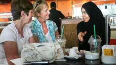 Fatima Salem (right) was among several Emirati women who met expatriate women in Abu Dhabi this week to discuss their perceptions of each other.