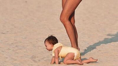Former The Only Way is Essex star, Ferne McCann, posing on the Le Royal Meridien Beach Resort & Spa beach with her daughter Sunday on January 22. Instagram / Ferne McCann