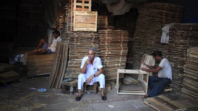 An owner of a packing business takes a tea break. Subhash Sharma for The National