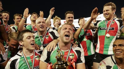 Ben Bolger, front and centre, led Abu Dhabi Harlequins to an unprecedented five trophies last season. The flanker has decided to retire rfrom rugby after suffering two concussions in four weeks. Victor Besa for The National