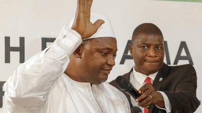 Adama Barrow, left, is sworn in as President of Gambia in Dakar Senegal. AP Photo