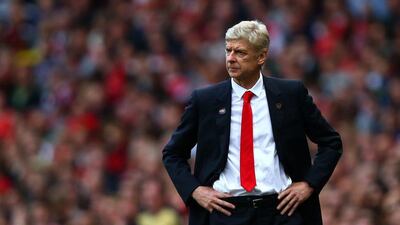 Arsenal manager Arsene Wenger observes his side during their 2-2 draw with Hull City at the Emirates Stadium on Saturday. Clive Rose / Getty Images / October 18, 2014