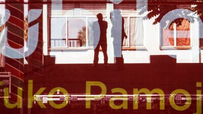 Police officers are silhouetted through a giant campaign flag during Kenya's ruling Jubilee coalition's campaign rally attended by its leader and incumbent president Uhuru Kenyatta in Nairobi on August 4, 2017. EPA / Dai Kurokawa
