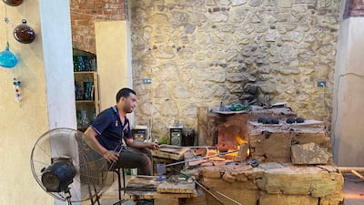 A traditional glass maker, seen while on a tour by Walk Like An Egyptian.